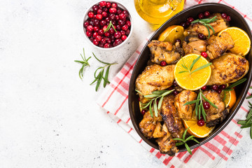 Baked chicken with orange, cranberry and rosemary.