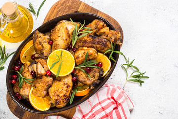 Baked chicken with orange, cranberry and rosemary.