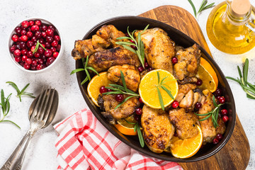Baked chicken with orange, cranberry and rosemary.