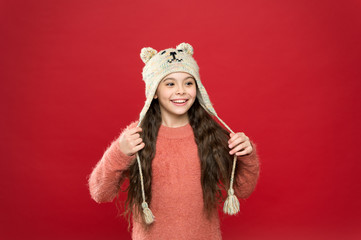 I love this hat so mush. Cozy winter outfit for kids. holiday activity outdoor. seasonal health care. small child ready for winter. happy little girl in earflap hat. kid fashion. Warm knitting tips