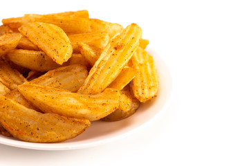 Pile of Spiced Potato Wedges Isolated on a White Background