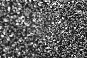 Background from black and white confetti. Blur effect on part of the photo