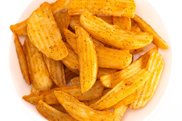 Pile of Spiced Potato Wedges Isolated on a White Background