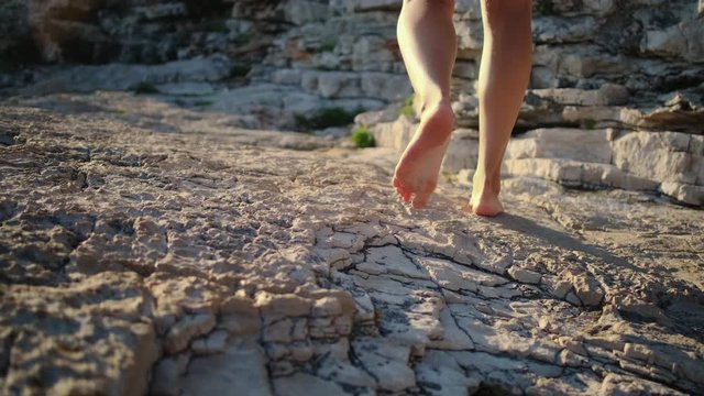 Walking barefoot on coastal rocks