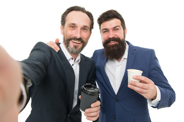 Selfie with friend. Lunch time. Small talk. Enjoying coffee. Bearded men communicate relaxing...