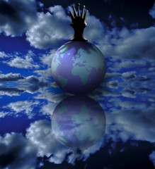 King of the Earth. Chess piece on the globe