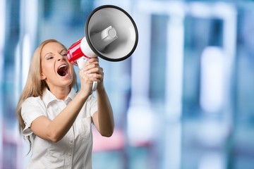 Woman holding megaphone and screams