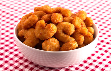 A Bowl of Popcorn Shrimp on a Red Gingham Table Cloth