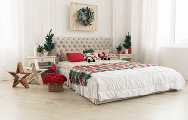 Bright decorated for Christmas bed room with two windows