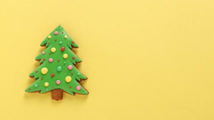 Edible Christmas tree, gingerbread, Happy New Year, yellow background, horizontal orientation