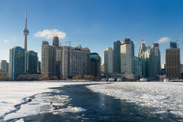 Ice breaking path of Wards Island Ferry on frozen Lake Ontario in Toronto winter