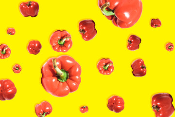 fresh red bell pepper on yellow background
