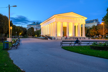 Landscape of white Column Hall in beautiful garden Volksgarten, Vienna.