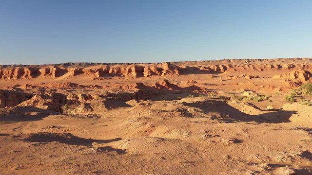 Martian landscape. Flaming Cliffs aerial view in the Gobi Desert, South Mongolia. Bayanzag region is most famous for yielding the first discovery of dinosaur eggs. Mongolia. Canyon Hermen-Tsav.