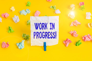 Writing note showing Work In Progress. Business concept for unfinished project that still added to...