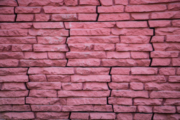 Pink stone wall, house facade