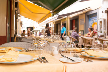 touristc restaurants and coffee shops in old city center , Funchal, Madeira Island , focus in foreground