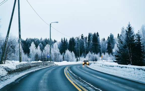 Car On Winter Road With Snow In Finland. Auto And Cold Landscape Of Lapland. Automobile On Europe Forest. Finnish City Highway Ride. Roadway And Route Snowy Street Trip. Driving