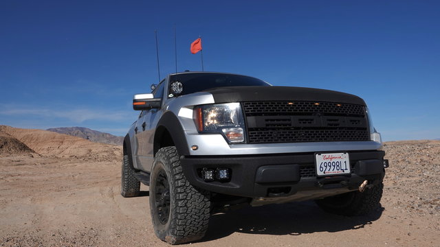 Low angle of 2011 Ford F-150 Raptor SVT off-road in desert. Body style of 2011 is same for 2012, 2013 and 2014. Photo taken in Ocotillo Wells, CA / USA - November 26, 2019.
