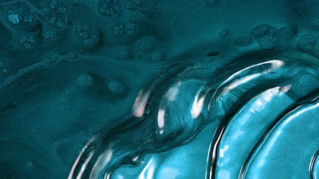 Super Slow Motion Shot of Blue Metallic Background at 1000fps.