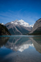 Picturesque landscape at Kinely Lake overlooking Mount Robson peak with water reflection