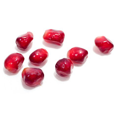 Pomegranate seeds isolated on a white backgound.