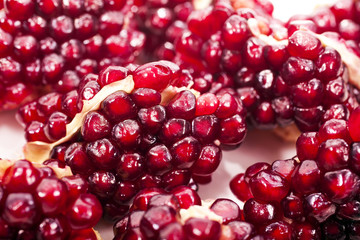 Pieces of pomegranate on a white background.