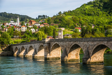 Fototapeta na wymiar View on the Mehmed Pasa Sokolovic Bridge over the river Drina, and the town of Visegrad, Bosnia and Herzegovina
