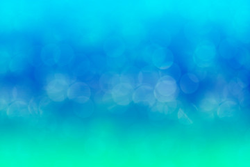 Abstract background. Distribution of white bokeh on a delicate blue background 
