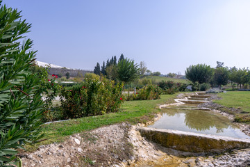 Fototapeta na wymiar Calcium deposits on travertine turquoise terraces at Pamukkale, Turkey