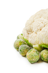 Cauliflower with frozen brussels sprouts cabbage isolated on white background.