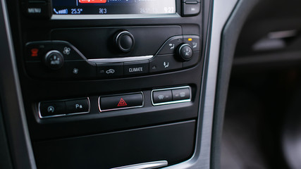 Emergency gang button and the air conditioner close up.