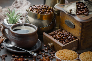 Coffee in a cup and saucer on an old background.