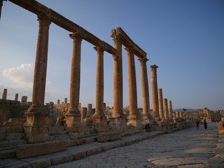 Fototapeta premium Pillars of roman ruins in the historic city of Jerash, Jordan, landscape of constructions build with columns