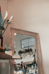 coffee shop decorated with trees in minimalist tones