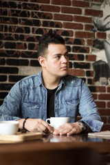 young man in a coffee shop 