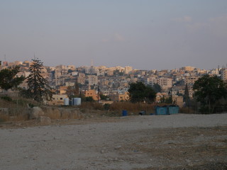 Cityscape of Jerash, Jordan, grey panorama of a modern Arabic city with improvised houses on a hill...