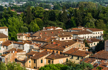 Fototapeta na wymiar View at traditional ancient Italian town with colorful houses in Tuscany from above