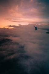 airplane flying above the clouds