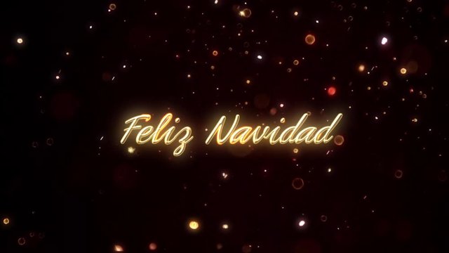 Feliz Navidad gold particle text animation on sparkle background.  Translation: Merry Christmas.
