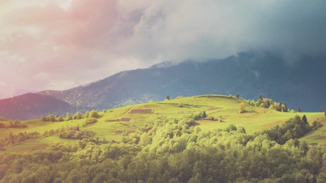 Panoramic view on mountains and valley with clouds