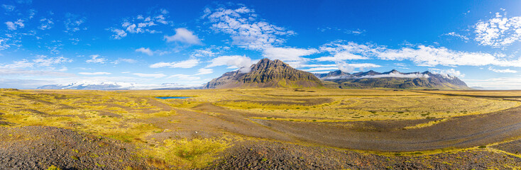 Panoramic picture of Vatnajoekull glacier tongues from Hoefn village