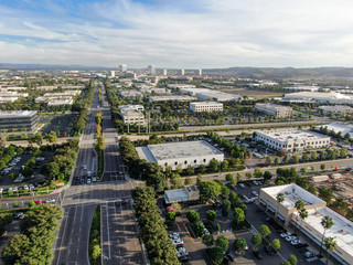 Aerial view of business and finance district with new office building surrounded by parking and...