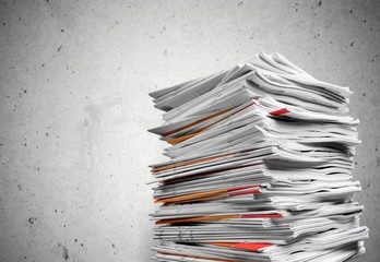 Stack of business documents on background