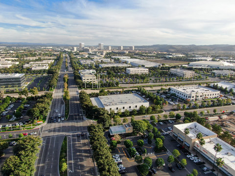Aerial view of business and finance district with new office building surrounded by parking and road. Irvine Business Complex. Irvine California. USA