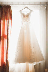 The perfect wedding dress in the room of the bride