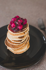 vegan banana pancakes stack with exotic dragonfruit coulis on top
