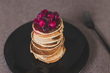 vegan banana pancakes stack with exotic dragonfruit coulis on top