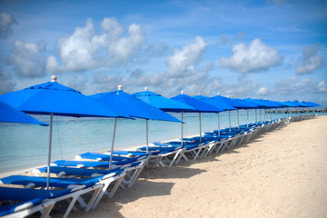 A place facing the Caribbean Sea. Beautiful beach in ISLA MUJERES Mexico, near the coral reef, with palong chairs where you can relax enjoying the breeze and the sun.