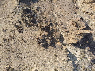 Desert with rocks, top view, texture with space